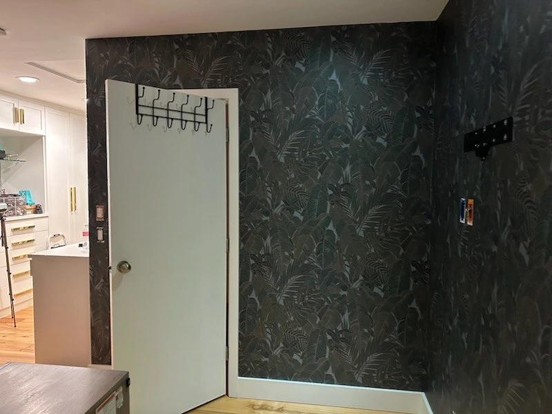 Wallpaper installer at work in Sterling Heights neighborhood Michigan