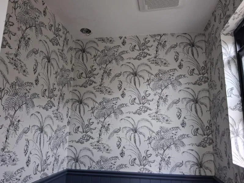 Wallpaper installer at work in Taylor neighborhood Michigan